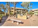 Comfortable seating area with a grill station offering a perfect outdoor space for relaxation and community gatherings at 1331 W Baseline Rd # 120, Mesa, AZ 85202