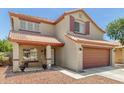 Charming two-story home features a well-maintained exterior, two-car garage, and lovely curb appeal at 1617 W Pecan Rd, Phoenix, AZ 85041