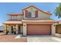 Charming two-story home features a well-maintained exterior, two-car garage, and lovely curb appeal at 1617 W Pecan Rd, Phoenix, AZ 85041
