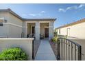 Inviting front porch featuring a cozy seating area, perfect for relaxing and enjoying the outdoors at 17520 W Fairview St, Goodyear, AZ 85338