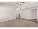 Bright living room featuring vaulted ceilings, carpet and hardwood flooring at 1918 S Shannon Dr, Tempe, AZ 85281