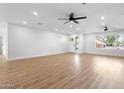 Spacious living room with modern flooring, ceiling fans, recessed lighting, and ample natural light at 2329 S Elm --, Mesa, AZ 85202