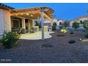Outdoor patio featuring a custom pergola and built-in outdoor kitchen at 27021 W Kerry Ln, Buckeye, AZ 85396