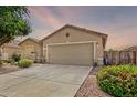 Single-story home with neutral stucco and low-maintenance yard, plus a two-car garage at 35397 N Shorthorn Trl, San Tan Valley, AZ 85143