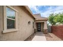 Welcoming front entry with stone accents on the columns and a brick walkway leading to the front door at 4323 E Wheaton St, Gilbert, AZ 85295