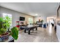 Spacious game room with a pool table, wet bar, and media center, perfect for entertaining at 514 E Yvonne Ln, Tempe, AZ 85284