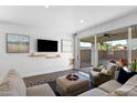 Comfortable living room with a sliding door to the backyard, perfect for indoor-outdoor living at 10714 E Lincoln Ave, Mesa, AZ 85212