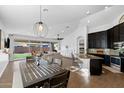 Open-concept living room with a view of the backyard and modern finishes at 10714 E Lincoln Ave, Mesa, AZ 85212