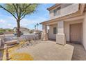 Inviting covered front porch with decorative columns and tile flooring, offering a welcoming entrance at 12630 W Corrine Dr, El Mirage, AZ 85335