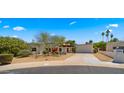 Inviting single-story home with a well-maintained yard, desert landscaping, and a private front entrance at 13007 N 1St St, Phoenix, AZ 85022