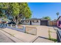 Charming home featuring a freshly painted exterior, manicured yard, and convenient driveway at 1325 W 7Th Ave, Mesa, AZ 85202