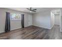 Bright living room with modern ceiling fan, hard surface floors and ample light at 1325 W 7Th Ave, Mesa, AZ 85202