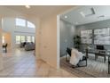 Open concept foyer leading into a bright living area and separate office space at 1634 W Red Bird Rd, Phoenix, AZ 85085