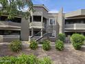 Exterior view of apartment building with mature landscaping at 1720 E Thunderbird Rd # 2087, Phoenix, AZ 85022