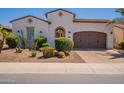 Beautiful single-story home with desert landscaping, brick driveway, and a well-maintained front yard at 1787 E Sattoo Way, Queen Creek, AZ 85140
