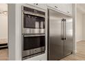 Gourmet kitchen features stainless steel appliances including double oven and fridge at 2552 E Silverwood Dr, Phoenix, AZ 85048