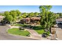 Beautifully landscaped front yard with a circular driveway leading to this well-maintained home at 2641 E Birchwood Pl, Chandler, AZ 85249