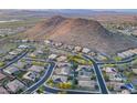 Scenic aerial view of the residential area showcasing desert landscape and mountain backdrop at 26879 N 100Th Ln, Peoria, AZ 85383