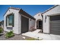 Charming single-story home with desert landscaping, two car garage and cozy courtyard entrance at 27636 W Runion Dr, Buckeye, AZ 85396