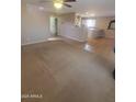 An open floor plan featuring both carpet and tile flooring, offering a versatile living space at 284 W Settlers Trl, Casa Grande, AZ 85122