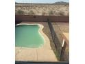 Backyard pool with desert landscape offers a private retreat at 284 W Settlers Trl, Casa Grande, AZ 85122
