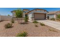 Charming single-Gathering home featuring a two-car garage and a low maintenance desert landscaped front yard at 37008 N Hinterwald Way, San Tan Valley, AZ 85143