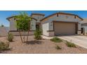 Charming single-Gathering home featuring a two-car garage and a low maintenance desert landscaped front yard at 37008 N Hinterwald Way, San Tan Valley, AZ 85143