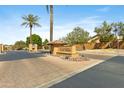 Community entrance sign reading Finisterra on a beige wall with a tiled roof and desert landscaping at 5122 S Miller Pl, Chandler, AZ 85249