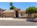 Lovely home with desert landscaping, showcasing a tiled roof and an attached two-car garage at 6631 E Rhodes St, Mesa, AZ 85215