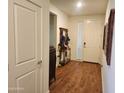 Bright entryway with hardwood floors and a coat rack with space for storage and decor at 7251 E Grouse Ct, San Tan Valley, AZ 85143