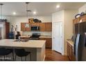 Open kitchen featuring a large island, stainless steel appliances, and ample cabinet storage at 7251 E Grouse Ct, San Tan Valley, AZ 85143