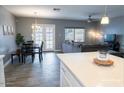 Open-concept living area with dining space and view to the back patio at 1017 W Piccadilly Rd, Phoenix, AZ 85013