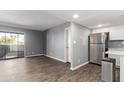 Open floor plan showcases the living room, balcony, and modern kitchen at 1730 W Emelita Ave # 2027, Mesa, AZ 85202