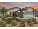 Beautiful single-Gathering home with lush landscaping, a two-car garage, and a welcoming front porch at 17362 W Wildwood St, Surprise, AZ 85388