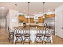 Beautiful kitchen with wooden cabinets, granite countertops, and a center island at 18226 W Marshall Ct, Litchfield Park, AZ 85340