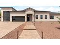 A welcoming single-Gathering home featuring a paved entryway and desert landscaping at 19622 W Pasadena Ave, Litchfield Park, AZ 85340