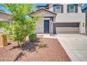 Charming home entrance with a landscaped yard and attached garage at 20808 W Granada Rd, Buckeye, AZ 85396