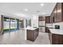 Spacious kitchen and dining area with sliding glass doors to backyard at 20808 W Granada Rd, Buckeye, AZ 85396