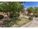 View of a single-story home's front exterior with a lush green lawn at 2727 S 160Th Ln, Goodyear, AZ 85338