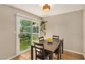Cozy dining area filled with natural light featuring a sliding glass door that opens to the backyard at 2834 S Extension Rd # 2001, Mesa, AZ 85210