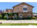 Attractive two-story home featuring stone accents, arched windows, and an inviting balcony at 3203 E Ellis St, Mesa, AZ 85213