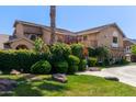 A stunning home featuring manicured lawns and shrubs surrounding its perimeter at 3203 E Ellis St, Mesa, AZ 85213