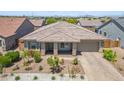 Charming single-story home with tile roof, desert landscaping, and a two-car garage at 3366 E Constance Way, Phoenix, AZ 85042