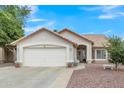Charming single-story home with a well-maintained yard, desert landscaping, and a spacious two-car garage at 616 E Sheffield Ave, Gilbert, AZ 85296