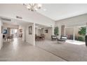 Bright open-concept living room with tile floors, fireplace, and backyard access at 6226 N 21St Dr, Phoenix, AZ 85015