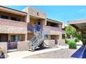 Attractive apartment complex with well-maintained landscaping and a clear blue sky in the background at 10828 N Biltmore Dr # 230, Phoenix, AZ 85029