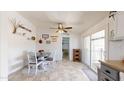 Charming dining room features a round table and chairs with a sliding glass door offering ample natural light at 11596 W Sierra Dawn Blvd # 33, Surprise, AZ 85378