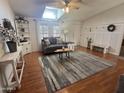 Comfortable living room featuring hardwood floors, lots of natural light, and vaulted ceilings at 11596 W Sierra Dawn Blvd # 33, Surprise, AZ 85378