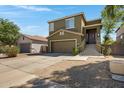 Charming two-story home with a two-car garage, an elevated front entryway, and low maintenance landscaping at 1281 E Frances Ln, Gilbert, AZ 85295