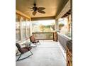 Relaxing front porch featuring comfortable seating and a ceiling fan at 13686 N 151St Dr, Surprise, AZ 85379